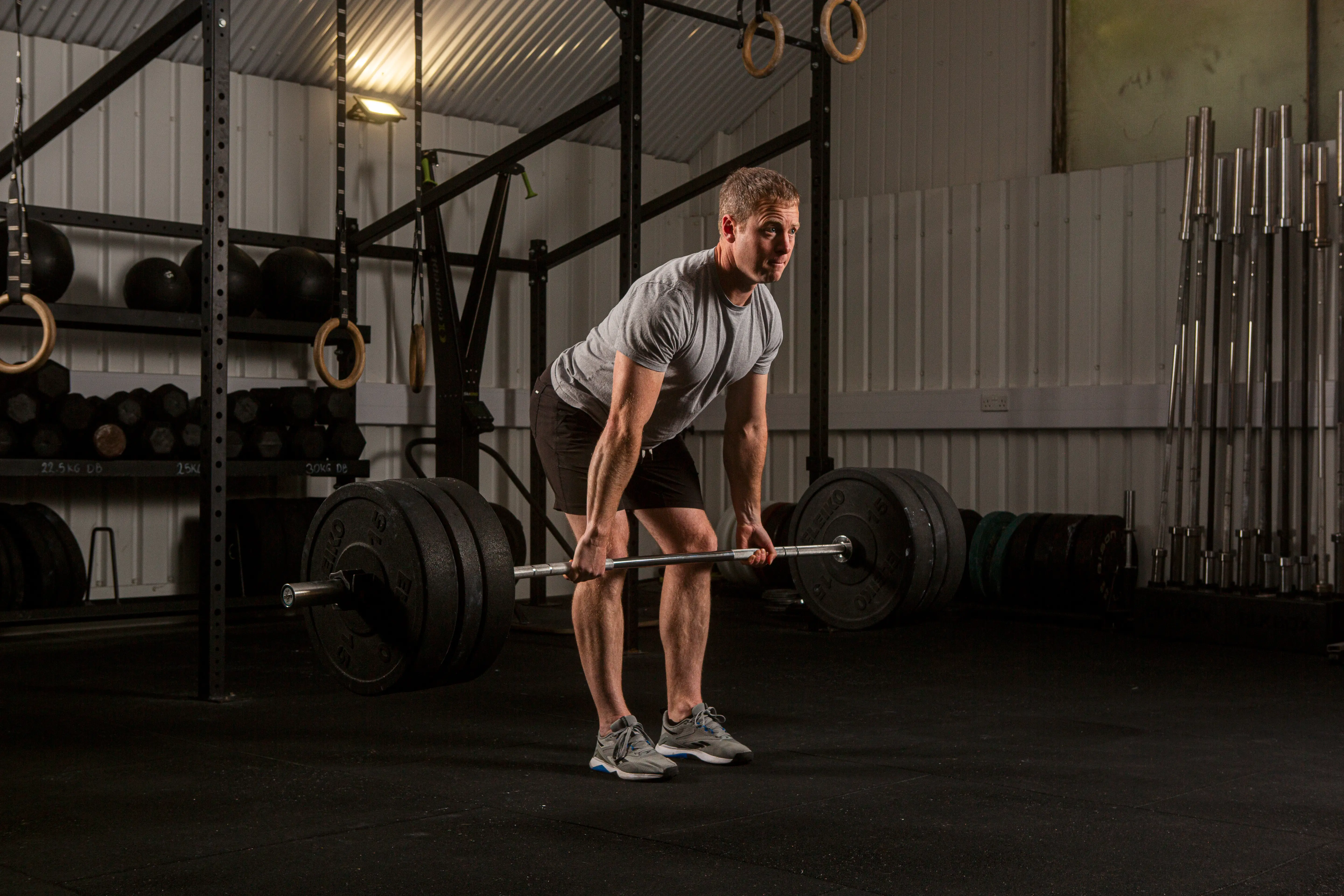 Stuart Frew coaching a client through a deadlift at Basis Gym, London Fields